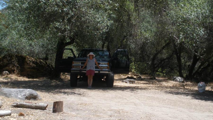 Kate White in front of the pickup truck she's driving to the site of the new Herland in South America.