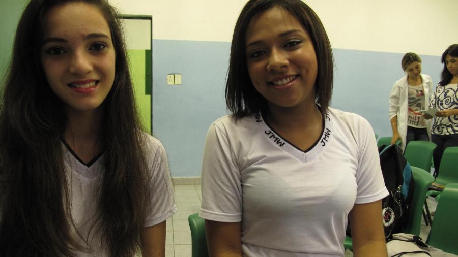 Sarah Campos (left) and Juliana Santos, former students of the Leão Machado School. Campos says she tried her first radish after working in the school garden. Now she loves them.
