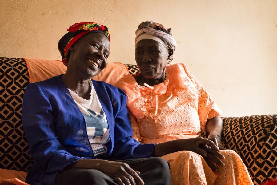 Sisters Cecilia and Norah share a couch in Arua, Uganda.