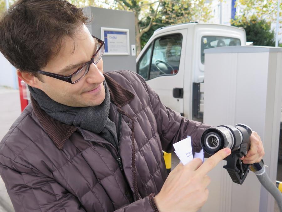 Alexander Conreder of the German utility ENBW holds a hydrogen fuel pump at a fueling station in Stuttgart. Backers of green hydrogen are hoping to make the transition from traditional fuels as easy as possible for consumers.