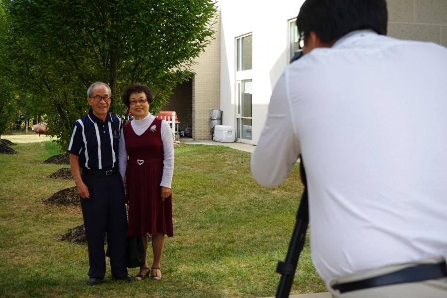 A couple poses for their graduation photo at the Duranno Father School.