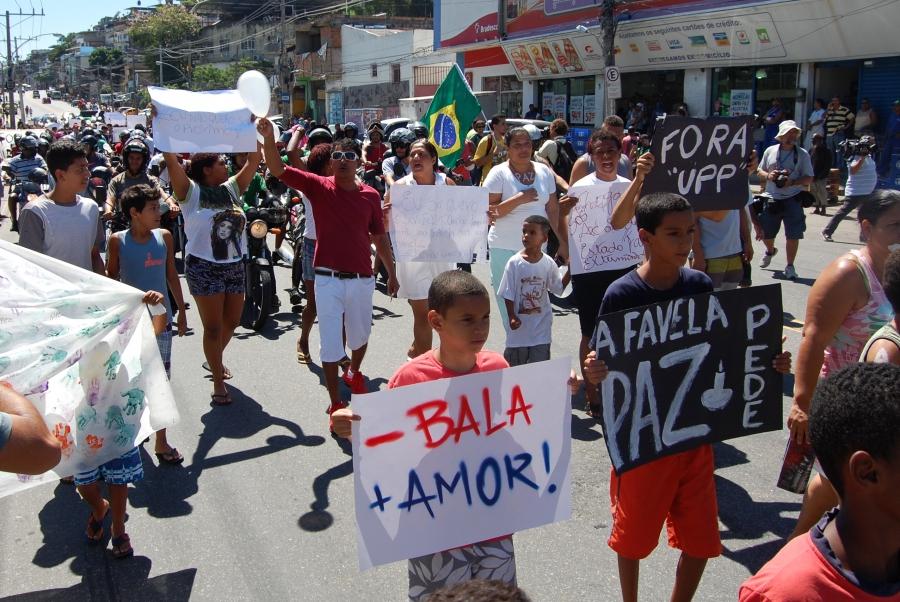 Favela residents march in a protest against the pacification police program in Rio de Janeiro.