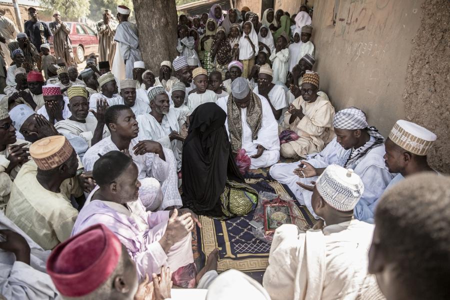The wedding fatiah of a village girl. A contract is announced and the men of the village say prayers and recite blessings. Women rarely interact with men who are not their relatives
