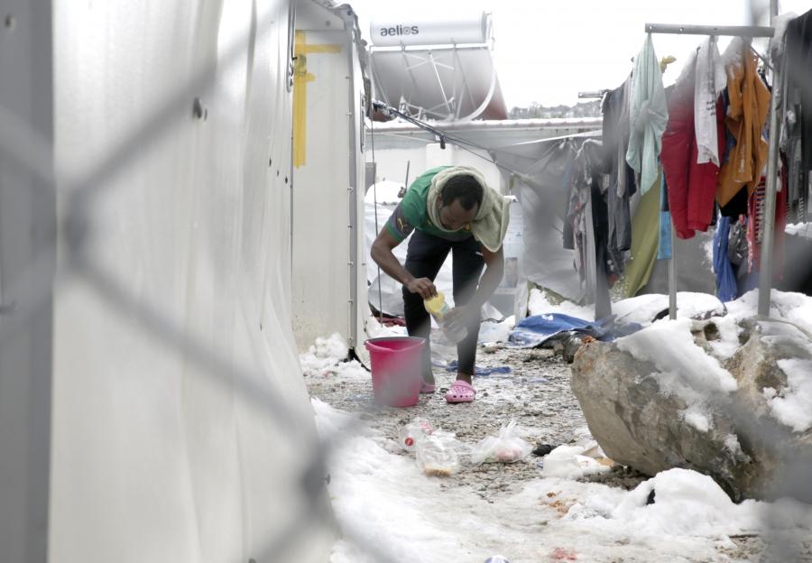 An English-speaking Cameroonian migrant washes himself at the Moria refugee camp on the Greek island of Lesbos.