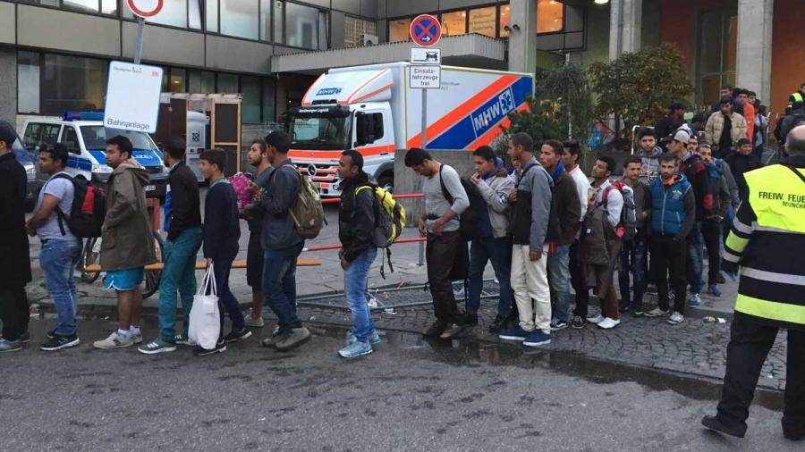 Crowds of migrants await medical checks soon after they arrive in Munich.