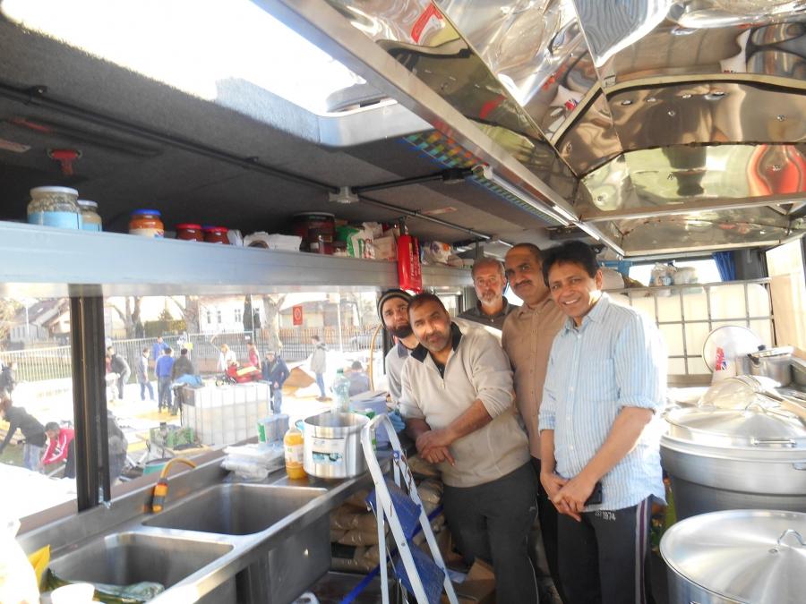 Ghafoor Hussain (second from right) with his team of volunteers. When he saw refugees being fed cold sandwiches, he decided to supply them with hot meals.