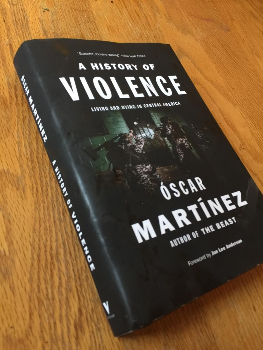 Front cover of "A History of Violence," book sitting on a table