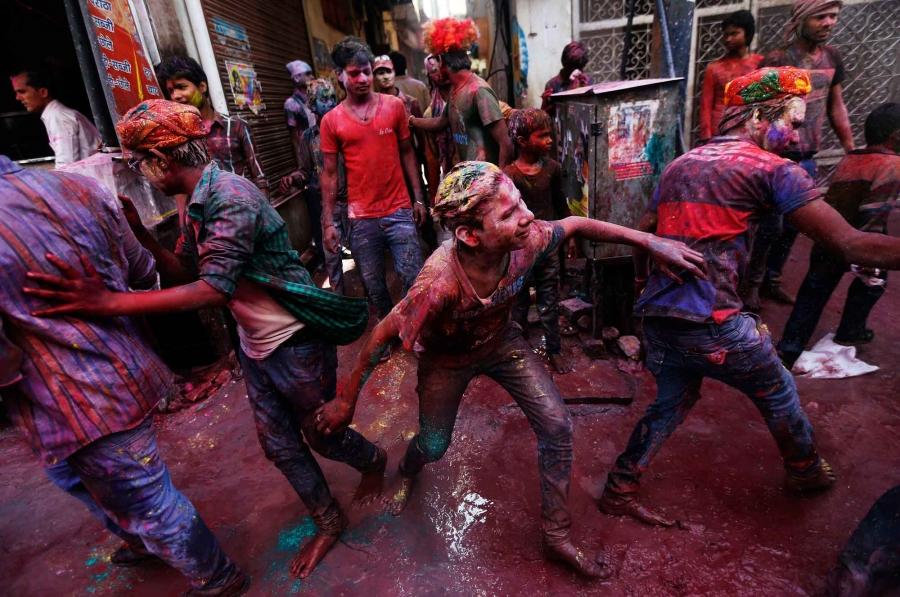People take part in the Holi celebrations in the northern Indian state of Uttar Pradesh.