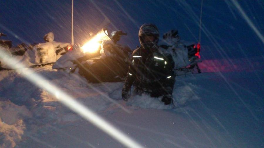 Snowmobile rescue crews work to reach stranded skiers on Vatnajökull glacier, Iceland.