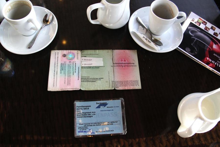 Dana Maghdeed Aziz’s German identification cards on the table in café in Erbil. After months in Germany he still didn’t know if he would be granted asylum.