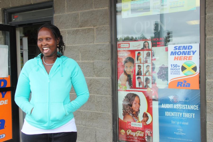 Nyakor Kueth, owner of the “African Market,” has become a local banker for many African immigrants looking for small loans.