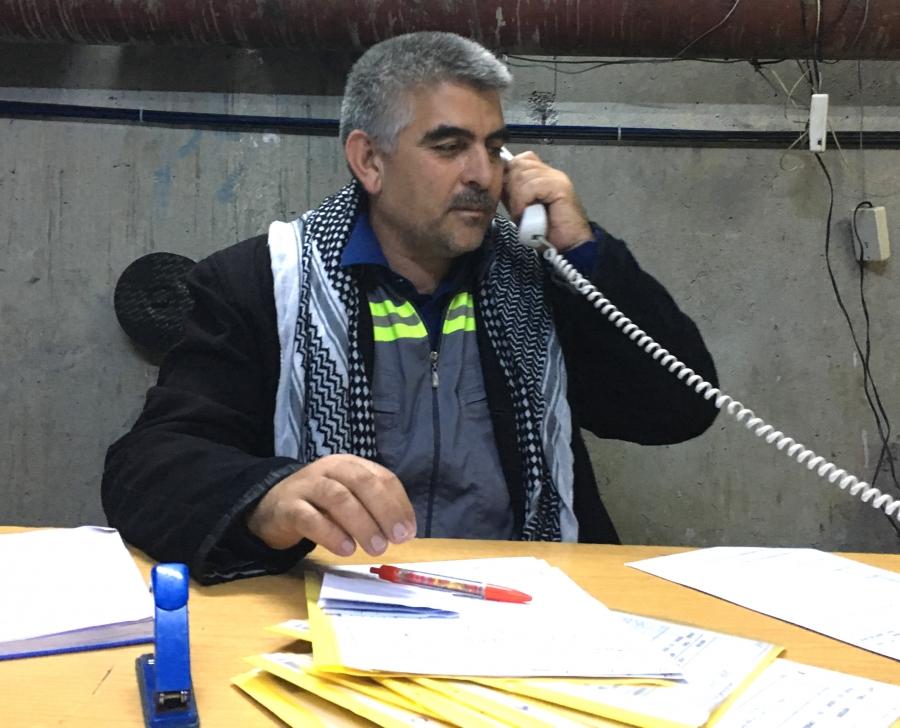 Aquil Muslim at his desk deep inside the Mosul Dam. He says the dam needs constant maintenance but the warnings are overblown.