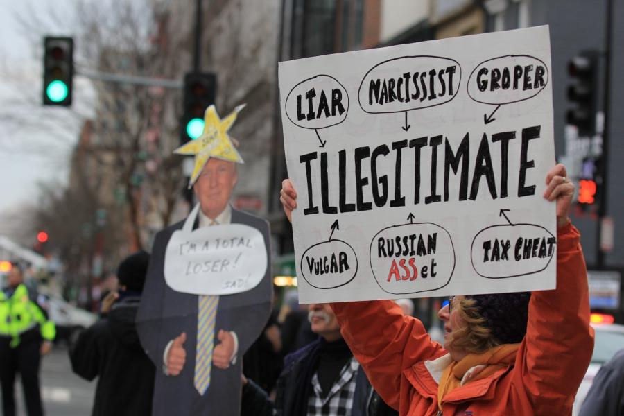Protestors hold signs in Washington, D.C.