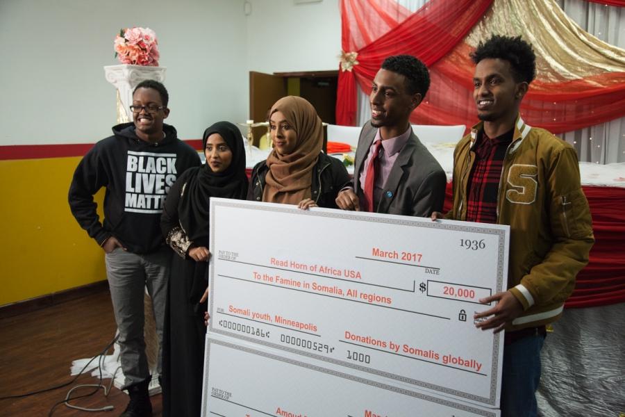 Group holds poster-size check