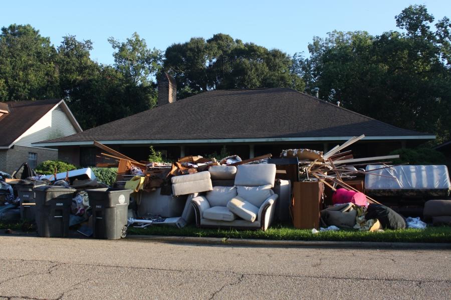 Piles of debris, like this one, are common outside homes across southeast Louisiana.
