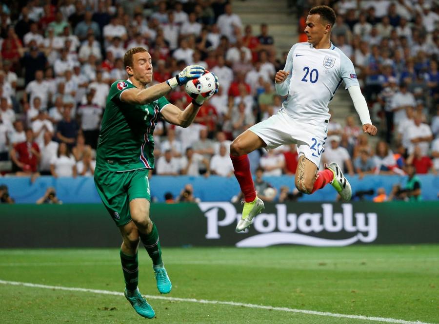 England's Dele Alli in action with Iceland's Hannes Halldorsson. 
