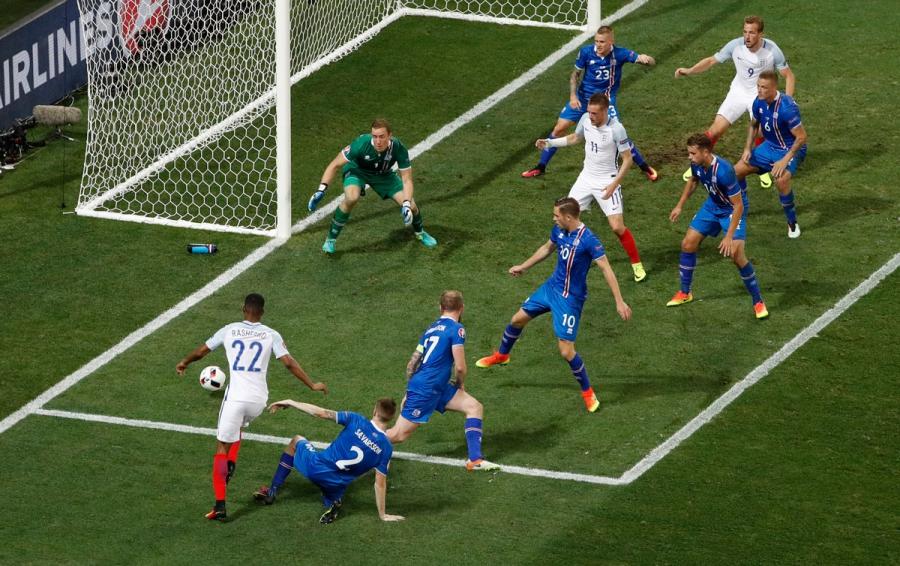 England's Marcus Rashford takes on Iceland's defense.