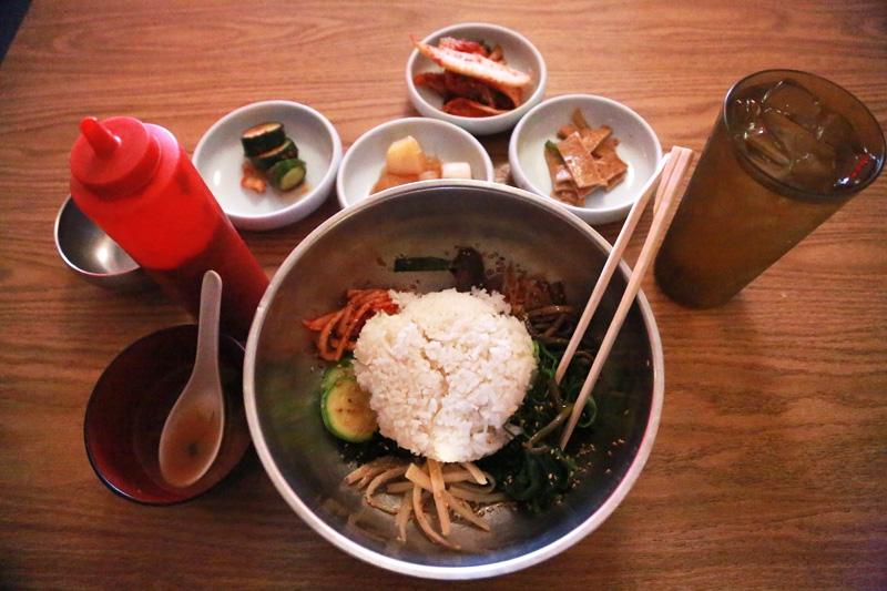 Bibimbap is one of the most popular dishes at Koreana restaurant in Killeen, Texas. It involves mounds of colorful sides, steamed rice and chili sauce.