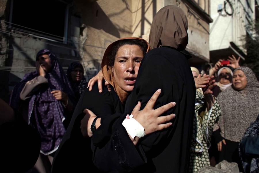 Women mourn during the funeral of the boys killed by an Israeli naval bombardment in the port of Gaza, Gaza City, July 16, 2014. Four boys died instantly during an Israeli naval bombardment in the port of Gaza, a fifth boy died shortly after the attack in