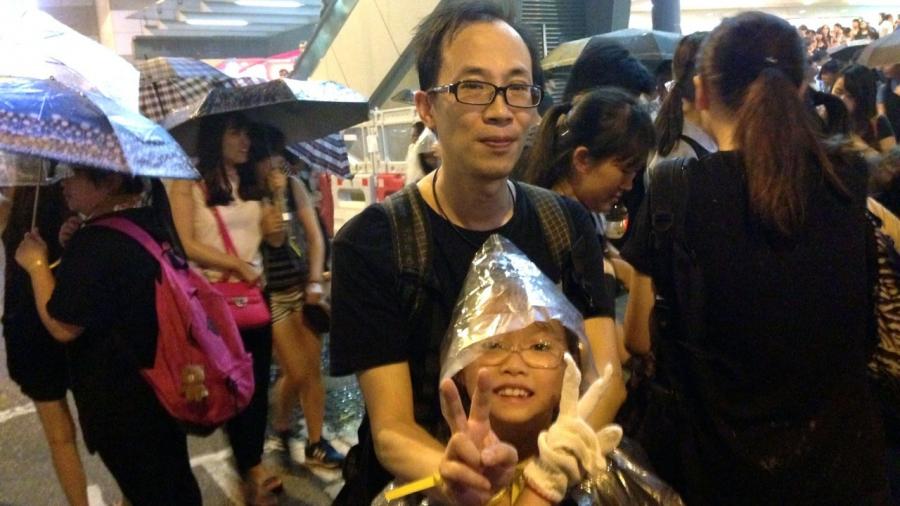 43 year-old Paka and his daughter, Icey (9) came out to protest (along with Paka’s wife and two older daughters) to show support for the student demonstrators.    