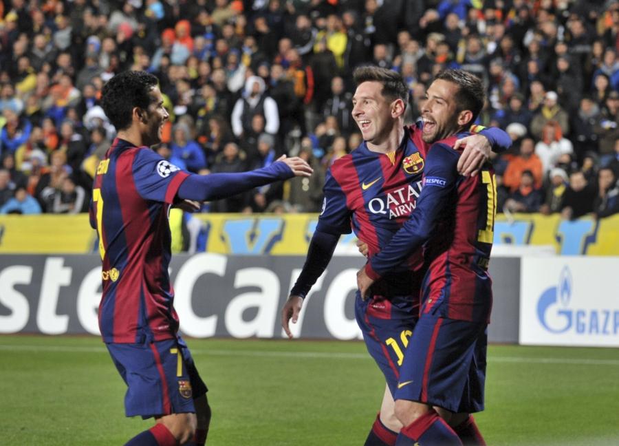Lionel Messi celebrates with teammates after his record-breaking goal.
