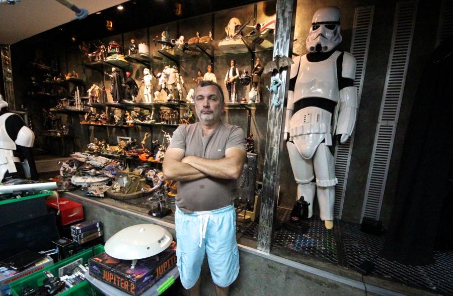 Biologist Mario Moscatelli poses with his collection of Star Wars memorabilia