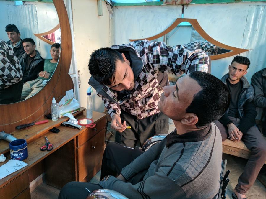 Kassem, a 25-year-old Yazidi barber, set up shop in a shack on top of Mount Sinjar.