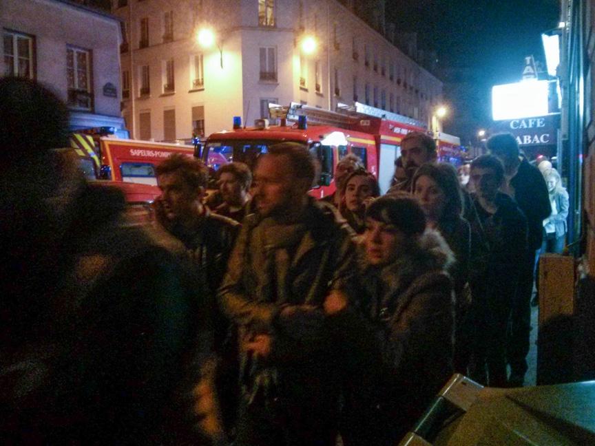 Concert-goers and bystanders outside the Bataclan concert hall after the attack on the Bataclan Friday night.