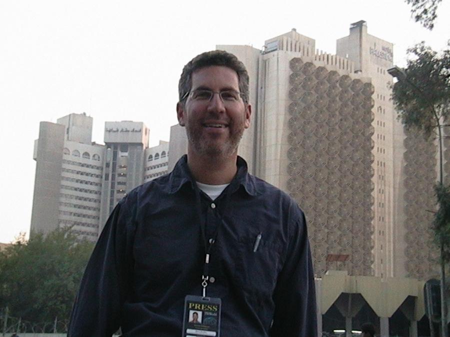 Aaron Schachter in front of the Palestine Hotel in Baghdad, across the street from the Sheraton.