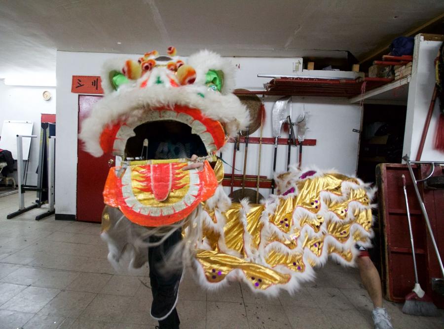 Dancers are supposed to control the lion head's ears and eyes by manipulating four strings with one hand, while the other supports and moves the head.