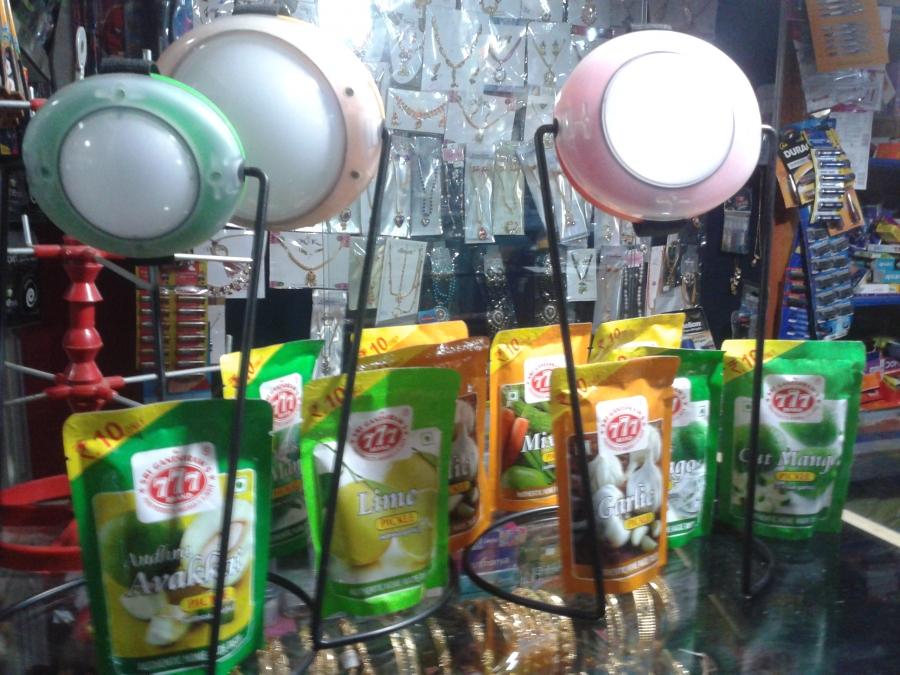 Essmart’s solar lamps on display along with a range of Indian pickles at a local store in Tamil Nadu.