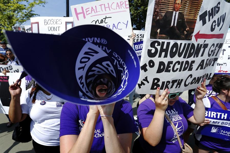Demonstrators in support of abortion and contraceptive rights chant in support of their cause after the Hobby Lobby ruling outside the U.S. Supreme Court in Washington June 30, 2014.