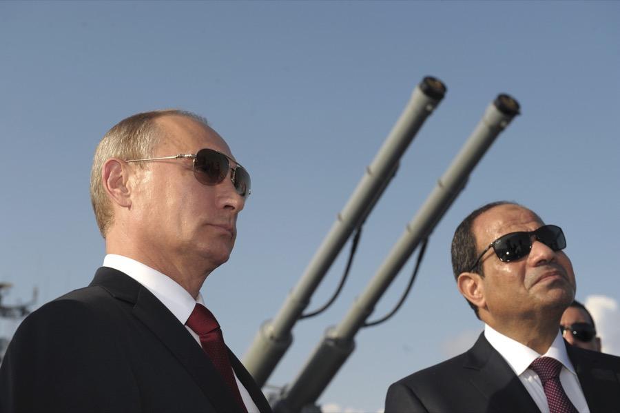 Egyptian President Abdul Fattah al-Sisi, right, with Russia's Vladimir Putin attend a ceremony onboard a guided missile cruiser at the Black Sea port of Sochi, in August 2014.