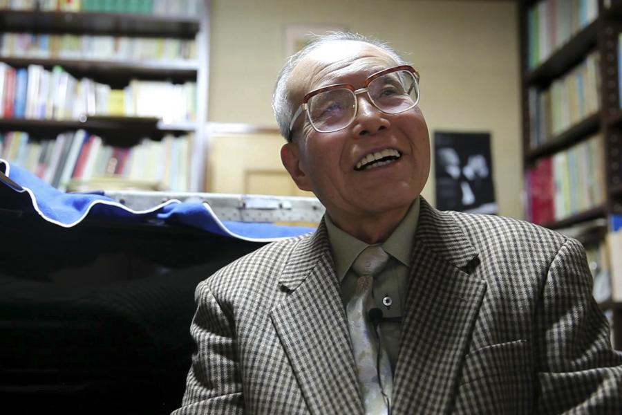 Survivor Shigeaki Mori, 77, smiling at his home in a suburb in Hiroshima November 30, 2014. Mori was eight when the United States dropped an atomic bomb on Hiroshima, incinerating the city.