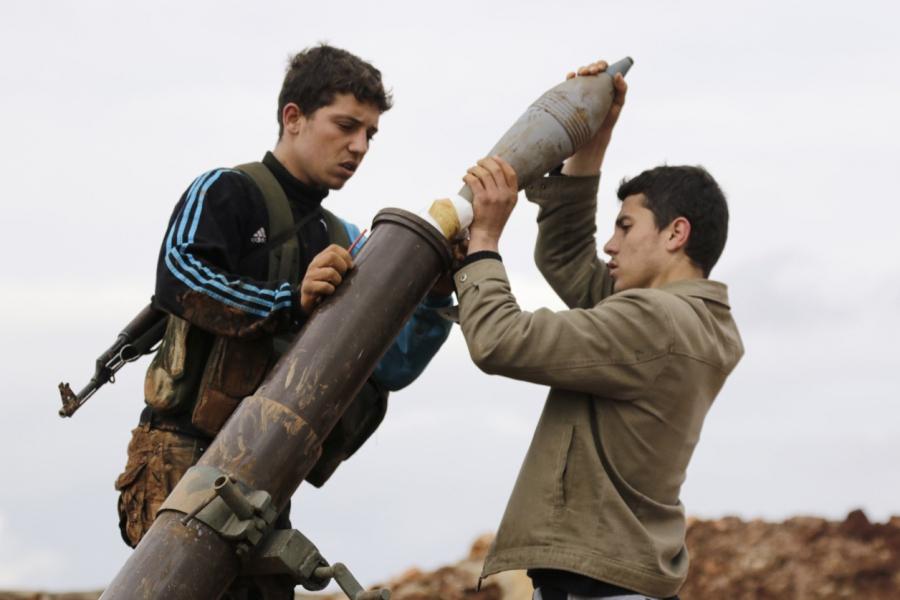 Nusra fighters prepare to fire a mortar toward Assad forces in al-Mallah farms, north of Aleppo, on Feb. 18, 2015.