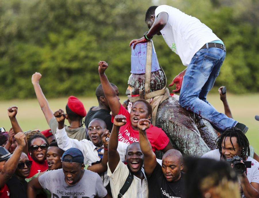Students cheer as the statue of Cecil John Rhodes is removed from the University of Cape Town (UCT), April 9, 2015. 
