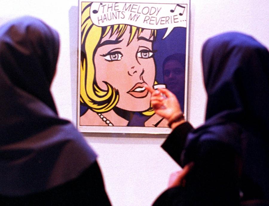 Iranian women look at a painting by Roy Lichtenstein in the museum of contemporary art in Tehran. This untitled painting was painted in 1965.