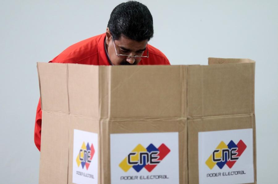 Venezuelan President Nicolás Maduro casts his vote at a polling station during the Constituent Assembly election in Caracas, Venezuela, July 30, 2017.