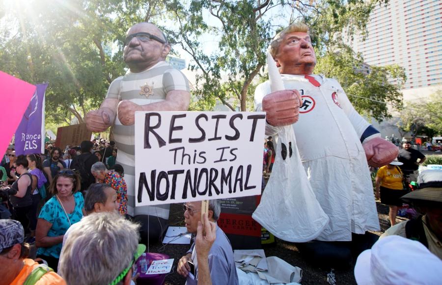 Protesters demonstrate outside President Donald Trump's campaign rally in Phoenix, Arizona, Aug. 22, 2017. 