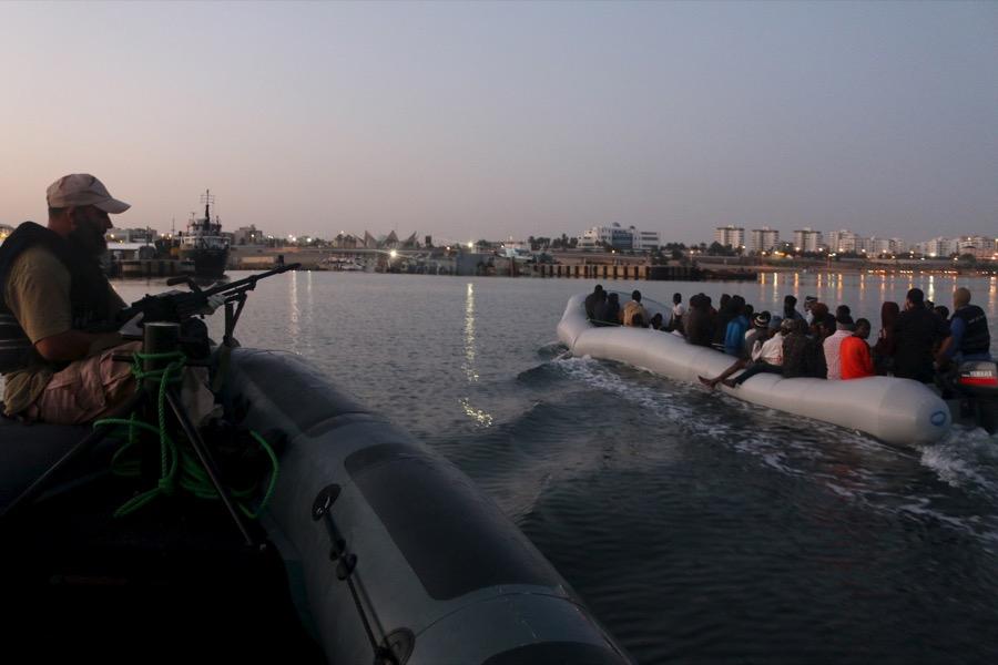 Migrants on a boat after being detained at a Libyan navy base in Tripoli.