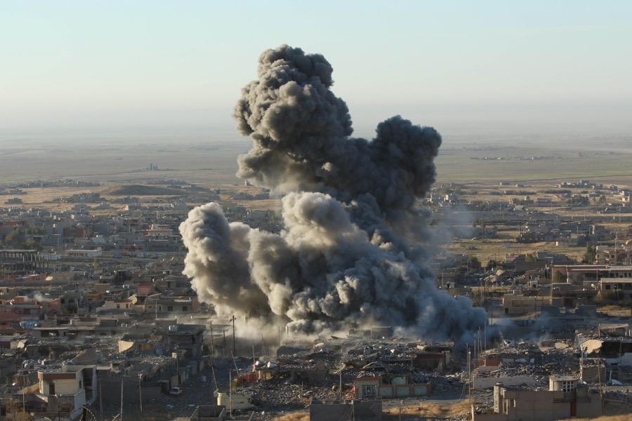 Smoke rises from the site of US-led airstrikes in the town of Sinjar on Nov. 12, 2015.