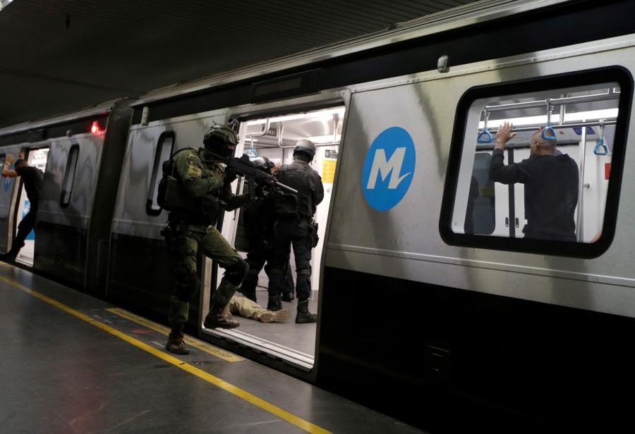 A Brazilian Marine takes part in exercises with officers of a French elite police unit in a Rio subway ahead of the Summer Olympics on June 10.