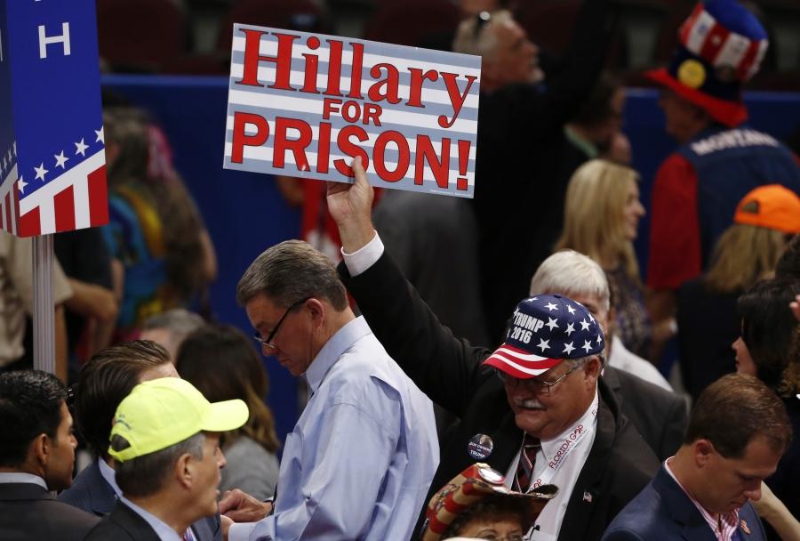 A supporter of Republican U.S. presidential candidate Donald Trump holds up a sign during the first day of the Republican National Convention in Cleveland, Ohio, U.S., July 18, 2016. 