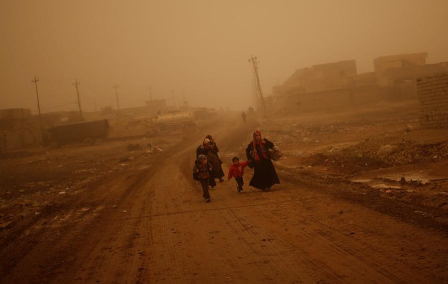 Iraqi families flee the Islamic State stronghold of Mosul in al-Samah neighborhood, Iraq on Dec. 2.