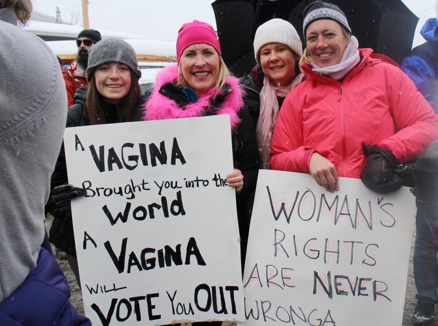 Park City resident Martina Costello (R), poses with friends as they hold up their signs during the Women's March protest