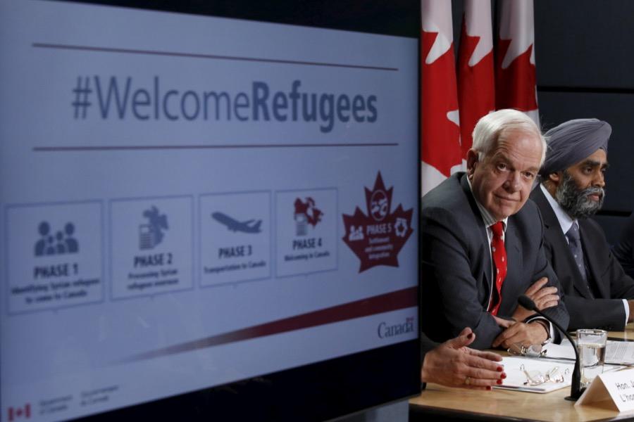 Canada's Immigration Minister John McCallum, left, and Defense Minister Harjit Sajjan speak to reporters in Ottawa, Canada on Nov. 24, 2015.