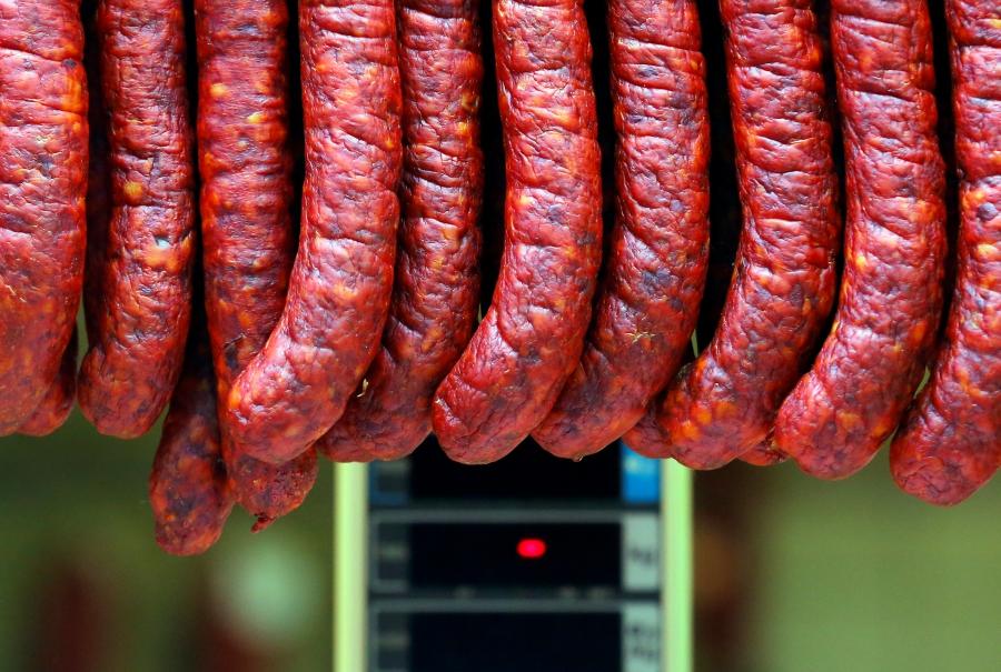 Sausages hanging at a vendor's stand at the Grand Market hall in Budapest, Hungary, May 15, 2016.