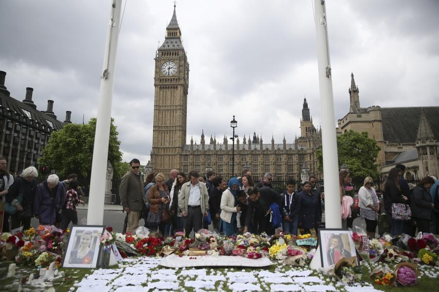 People view tributes in memory of murdered Labour Party MP Jo Cox, who was shot dead in Birstall, at Parliament Square in London, Britain June 18, 2016.