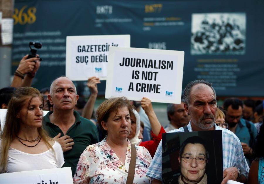 Demonstrators shout slogans during a protest against the arrest of three prominent activists for press freedom, in central Istanbul, Turkey, June 21, 2016.