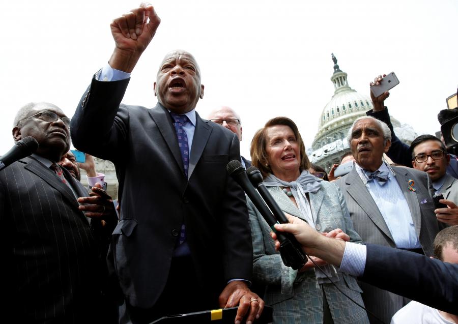U.S. Rep. John Lewis (D-GA) (2nd L) talks to supporters along with House Democrats after their sit-in over gun-control law on Capitol Hill in Washington, U.S., June 23, 2016.